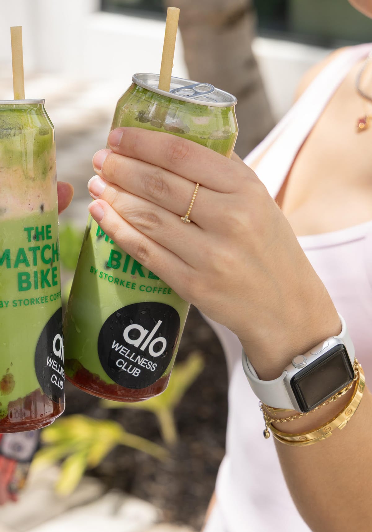 Close-up of a layered matcha can in hand