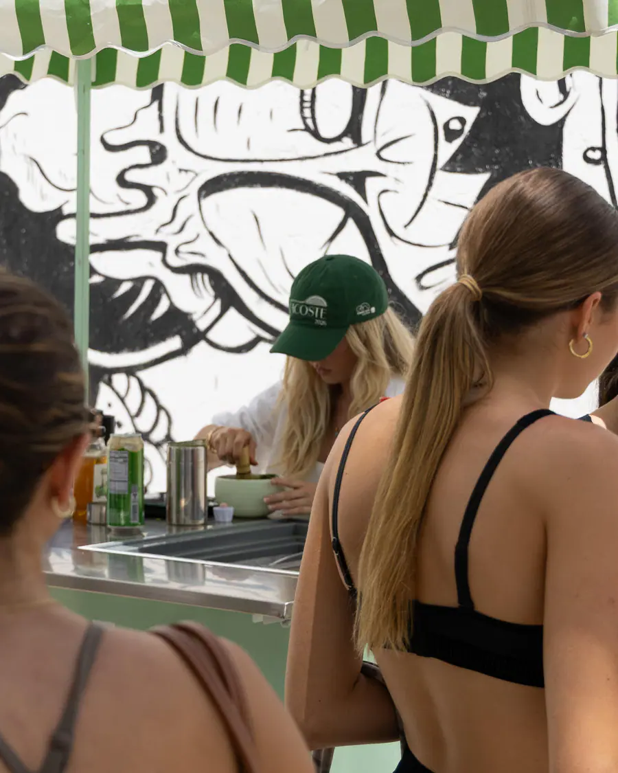 A Matcha Bike barista whisking matcha during a Miami event